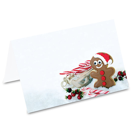 tischkarte "lebkuchen", lebkuchenmann mit schlitten und zuckerstangen im schnee auf vorderseite