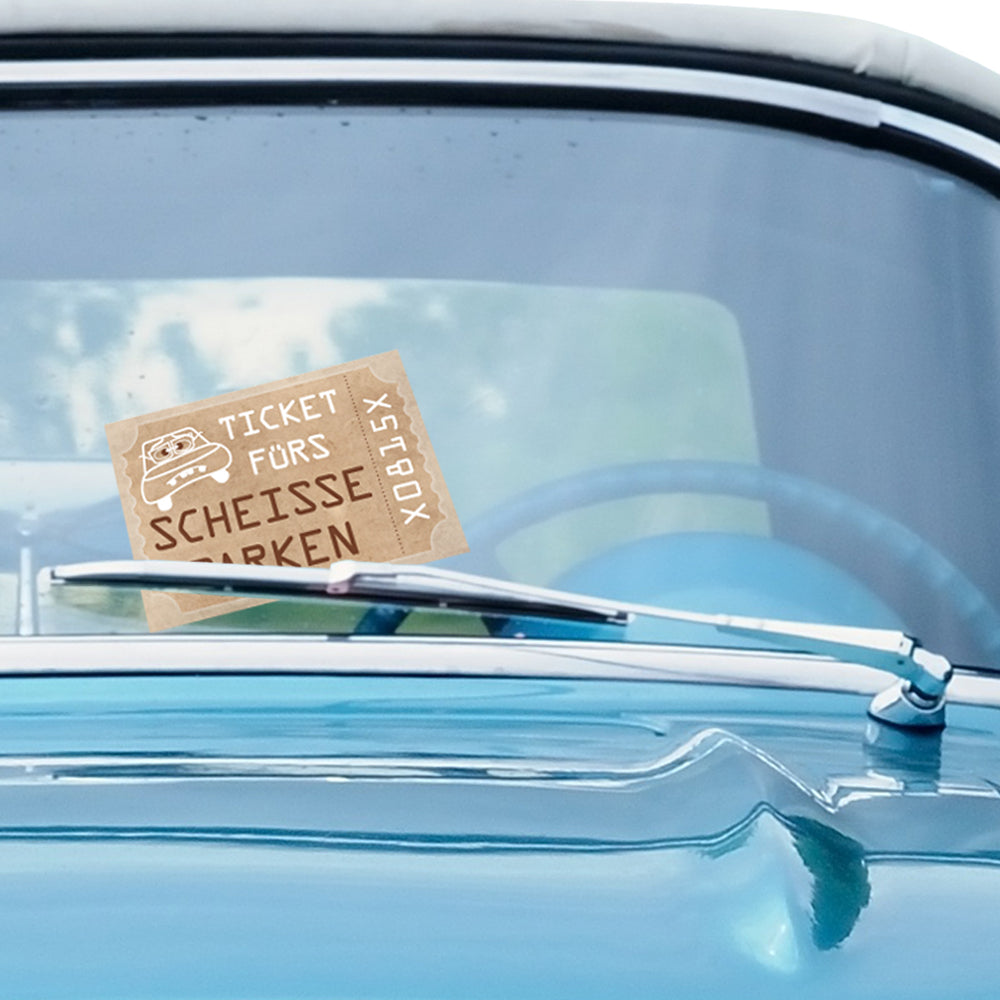 flyer scheiße geparkt "ticket", beige optik mit aufdruck "ticket fürs scheisse parken", an windschutzscheibe