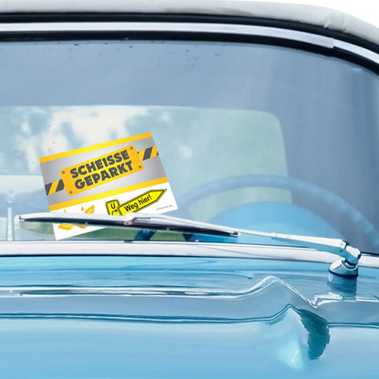 flyer scheisse geparkt "baustelle" mit der aufschrift " scheisse geparkt", an windschutzscheibe